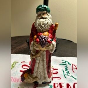 Festive musical Santa Claus Figurine with Fruit Accents